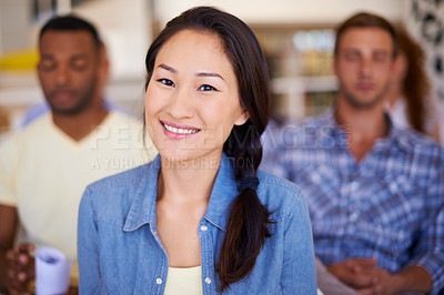 Buy stock photo Woman, office and portrait in crowd for meeting with smile, pride or career at media company. Person, happy and audience at startup, boardroom or employee training for development at creative agency