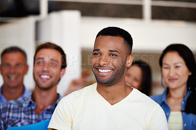 Buy stock photo Shot of a group of business colleagues listening to a work presentation