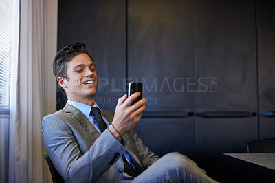 Buy stock photo Business, man and happy with smartphone at office on internet, email notification or text message as lawyer. Male person, employee and smile on website or social media for communication or networking