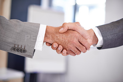 Buy stock photo Cropped closeup shot of two businessmen shaking hands