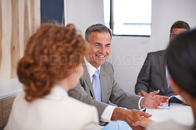 Buy stock photo Business people, handshake and CEO conversation with team management of partnership meeting. Shaking hands, communication and agreement at table with deal and operation review success in office