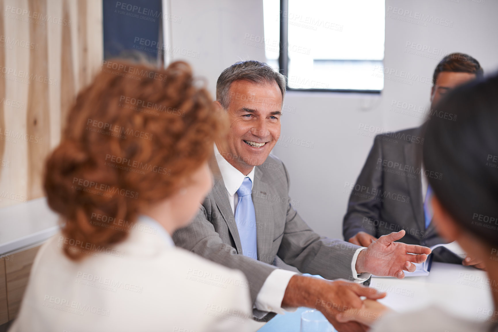 Buy stock photo Business people, handshake and CEO conversation with team management of partnership meeting. Shaking hands, communication and agreement at table with deal and operation review success in office