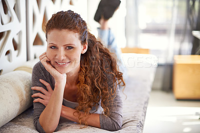 Buy stock photo Woman, lying and smile on sofa, portrait and home in morning, comfortable and confident in living room. Person, happy and pride on lounge, couch and relax on weekend for rest at apartment in Ireland