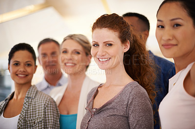 Buy stock photo Portrait of a diverse group of casually-dressed employees standing together indoors