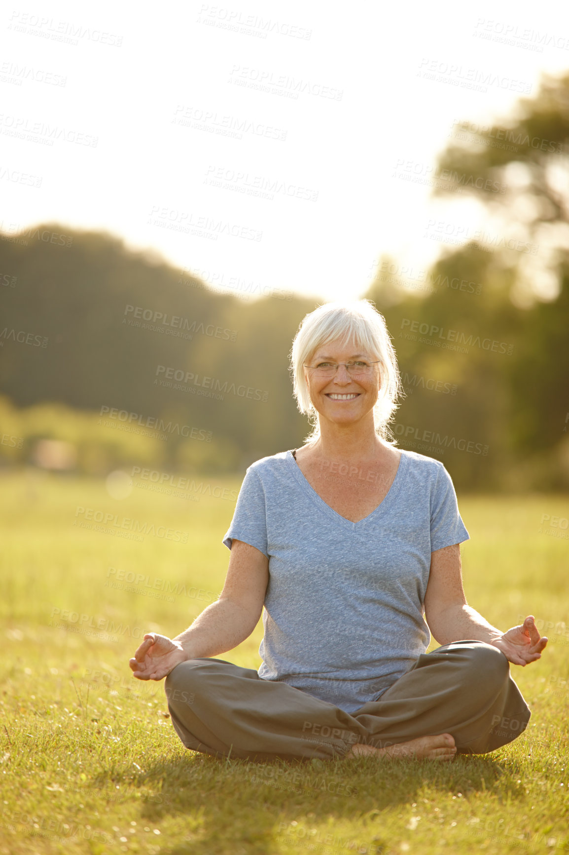 Buy stock photo Portrait, yoga and old woman in park, meditation and smile with wellness, nature and fitness. Face, pensioner and mature person on grass field, exercise and morning routine with healthy and workout