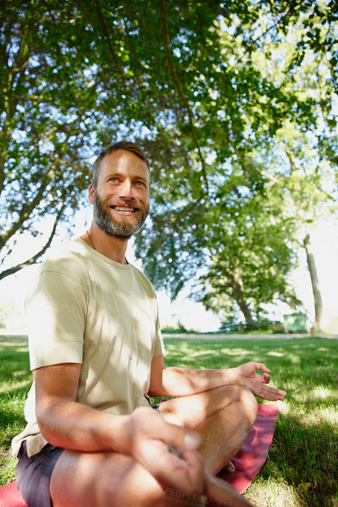 Buy stock photo Portrait, yoga and man with meditation, outdoor and smile with wellness, morning routine and lotus. Face, person and guy with exercise in park, nature or summer with break, zen or chakra with fitness