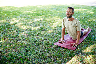 Buy stock photo Park, man and smile on yoga mat with stretching for fitness, exercise and workout in Germany. Male person, outdoor and happy or satisfied on grass for self care, health and wellness as routine