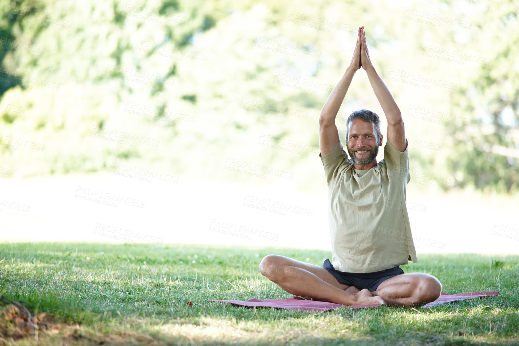 Buy stock photo Full length shot of a handsome mature man doing yoga outdoors