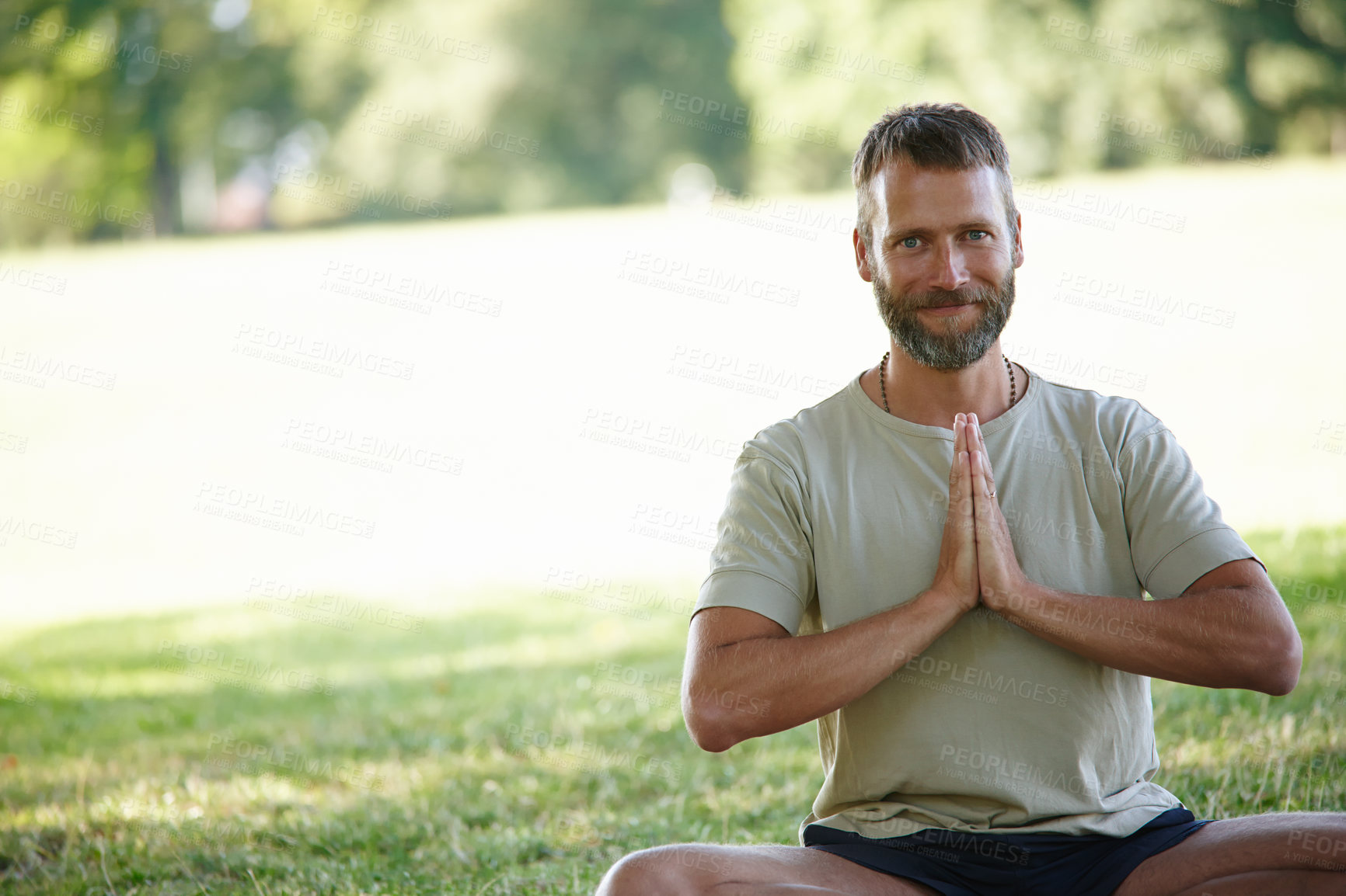 Buy stock photo Portrait, yoga and man in park, balance and smile with wellness, hands together and lotus. Face, person and guy with exercise, outdoor and summer with health, zen and chakra with fitness or nature