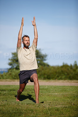 Buy stock photo Nature, man and stretching at park with yoga for exercise, balance and mobility on grass. Pilates, mature yogi and warrior pose on lawn for workout, holistic wellness and posture with fitness outdoor