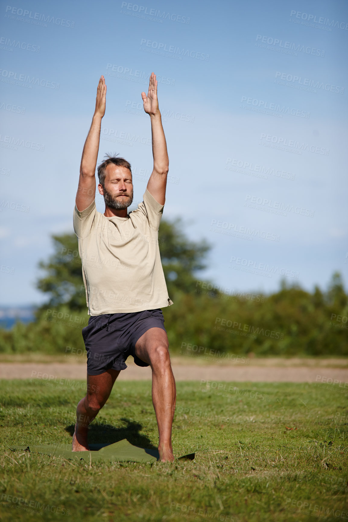 Buy stock photo Nature, man and stretching at park with yoga for exercise, balance and mobility on grass. Pilates, mature yogi and warrior pose on lawn for workout, holistic wellness and posture with fitness outdoor