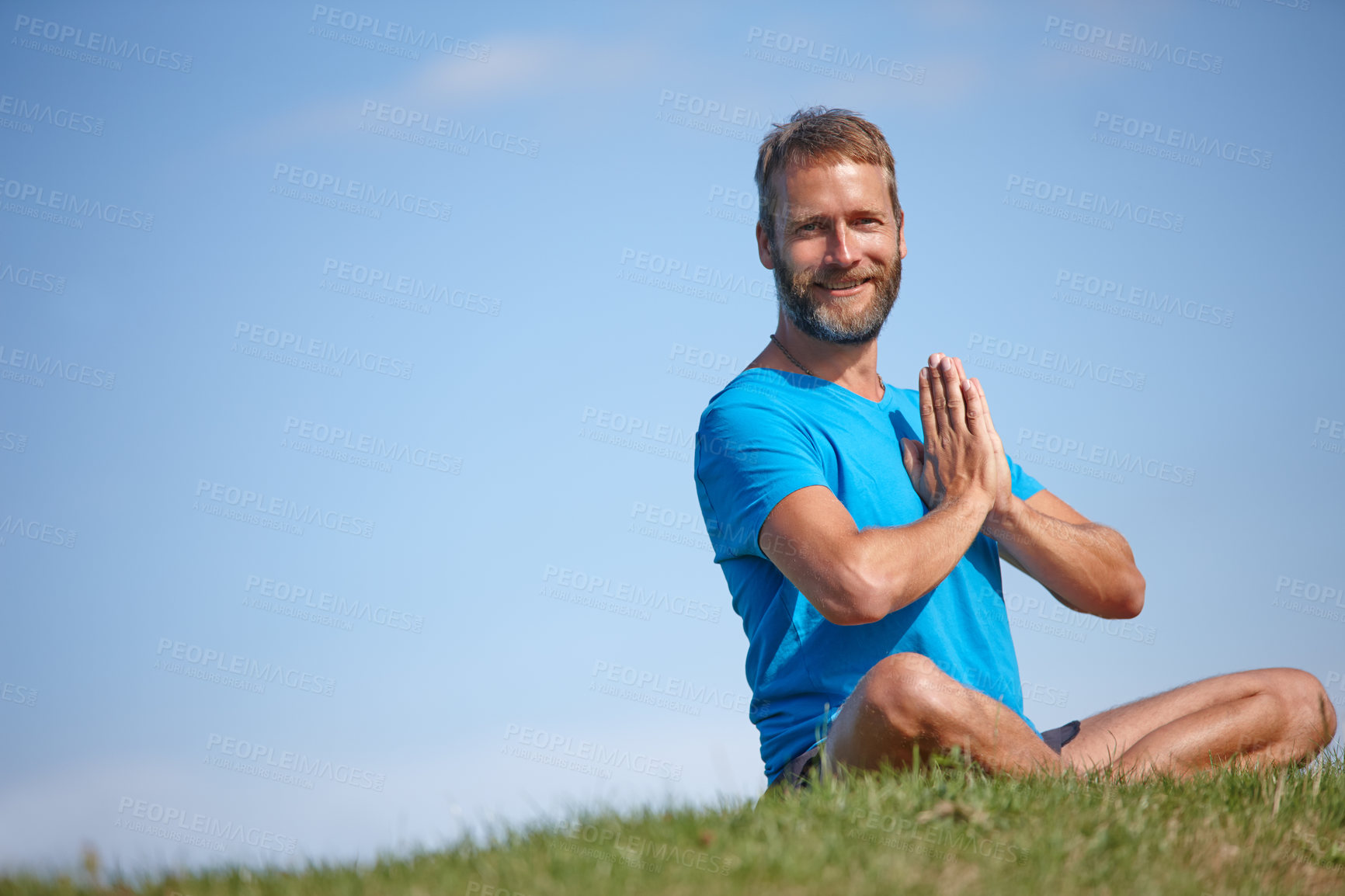 Buy stock photo Portrait, prayer hands and man on grass for meditation, mockup space or holistic health for soul. Sit, yoga and zen yogi in park for mindfulness, chakra balance or peace with awareness or fresh air