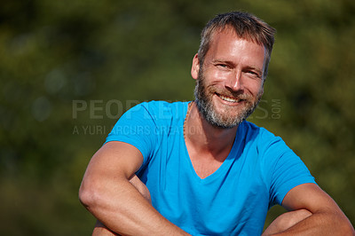 Buy stock photo Happy man, portrait and relax outdoor for break, holiday and positive mood with calm, peace and joy. Male person, face and smile in nature for vacation, weekend and sunshine with leisure in morning 