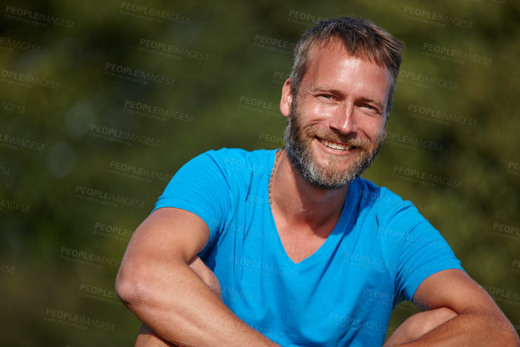 Buy stock photo Happy man, portrait and relax outdoor for break, holiday and positive mood with calm, peace and joy. Male person, face and smile in nature for vacation, weekend and sunshine with leisure in morning 