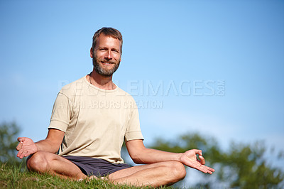 Buy stock photo Yoga, portrait and happy man with lotus on grass outdoor for exercise, meditation or chakra for holistic fitness. Mature, yogi and pose for healthy mind, body wellness and relax with space in Sweden