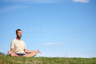 Buy stock photo Yoga, meditation and man with lotus outdoor for breathing exercise, mindfulness or zen for holistic fitness on grass. Mature, yogi or pose for health, body wellness or relax for peace on mockup space