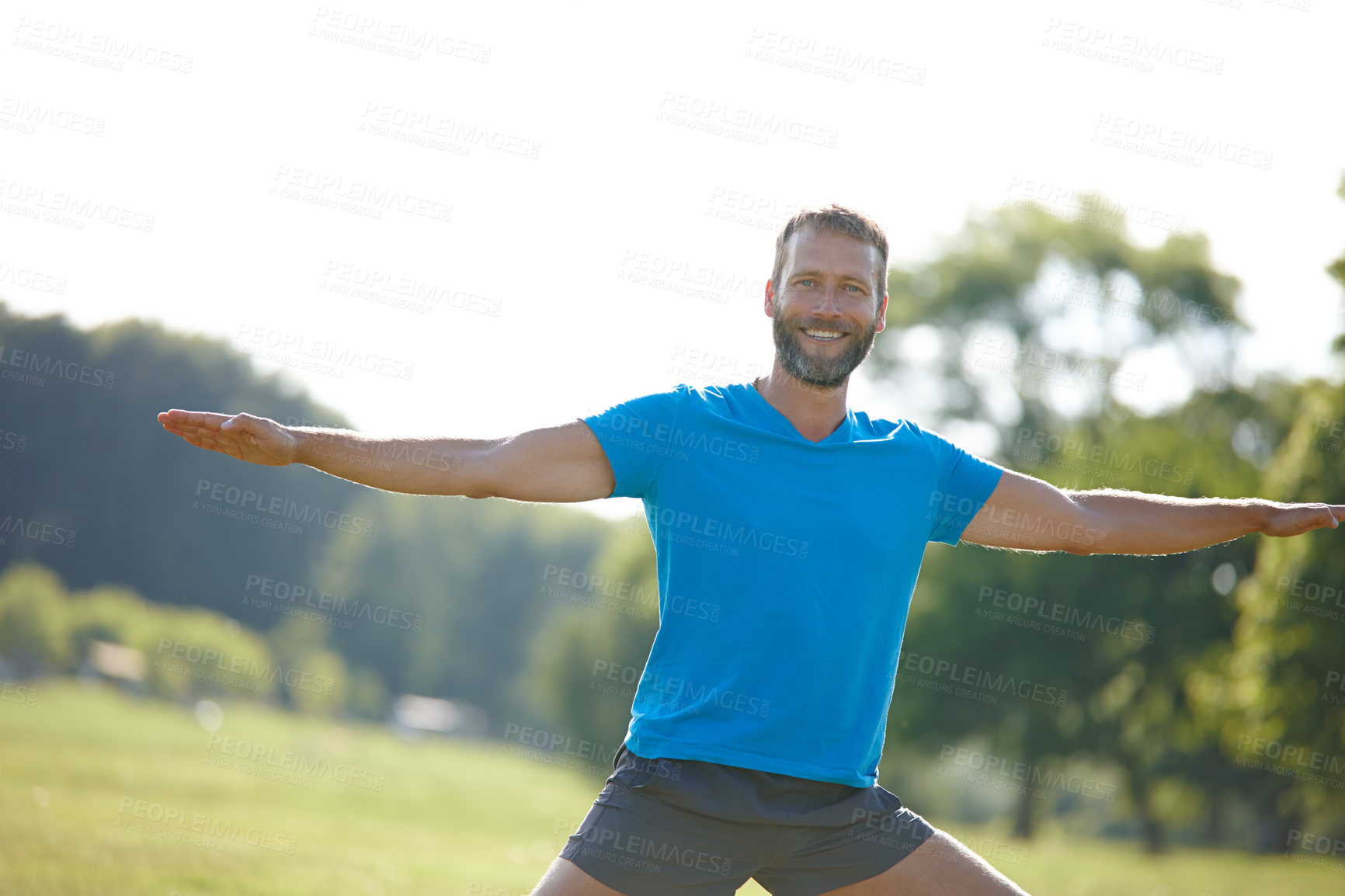 Buy stock photo Park, man and smile with stretching for fitness, exercise and workout in Germany. Male person, outdoor and happy or satisfied on portrait at forest for self care, health and wellness as routine