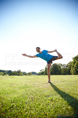 Buy stock photo Full length shot of a handsome mature man doing yoga outdoors