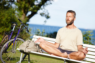 Buy stock photo Yoga, meditation and mature man with lotus at park for breathing exercise, mindfulness or holistic fitness. Zen, yogi and pose for health, body wellness and chakra to relax for peace on bench outdoor