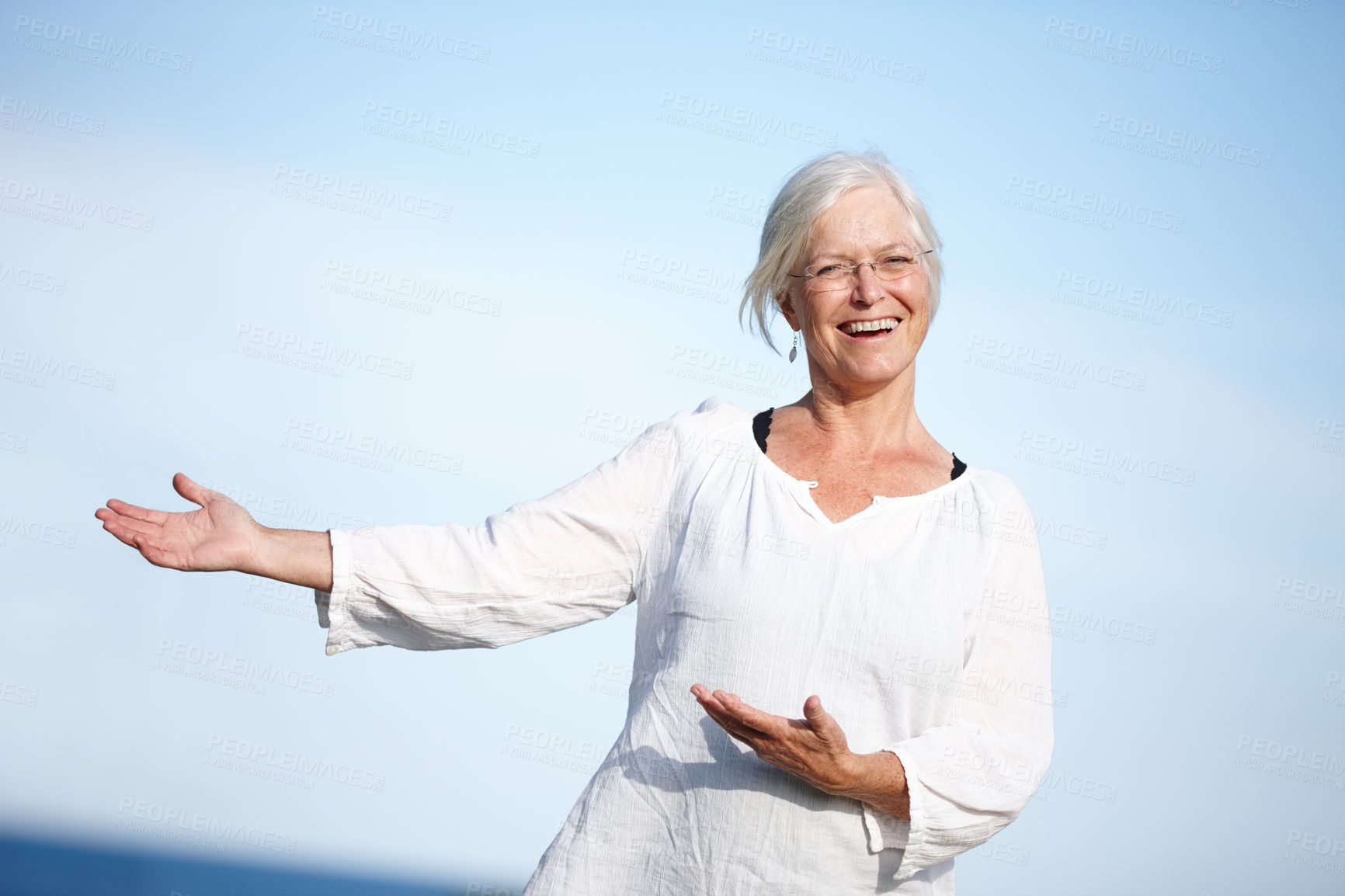 Buy stock photo Senior, woman and portrait with advertising for presentation on blue sky mockup space. Mature, person and show product placement for promotion, information and happy with retirement plan opportunity