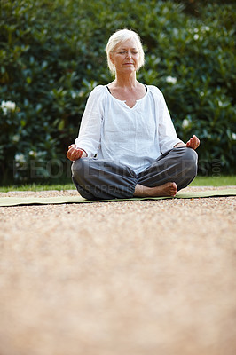 Buy stock photo Meditation, lotus pose and woman with relax in nature for breathing, calm and grounding exercise. Health, peace and senior female person in padmasana for outdoor flexibility, balance and mindfulness.