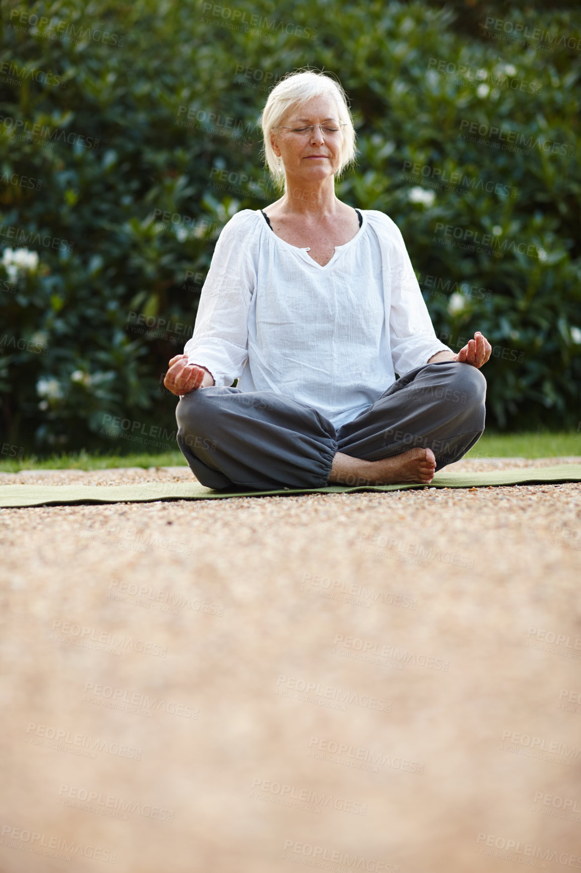 Buy stock photo Meditation, lotus pose and woman with relax in nature for breathing, calm and grounding exercise. Health, peace and senior female person in padmasana for outdoor flexibility, balance and mindfulness.