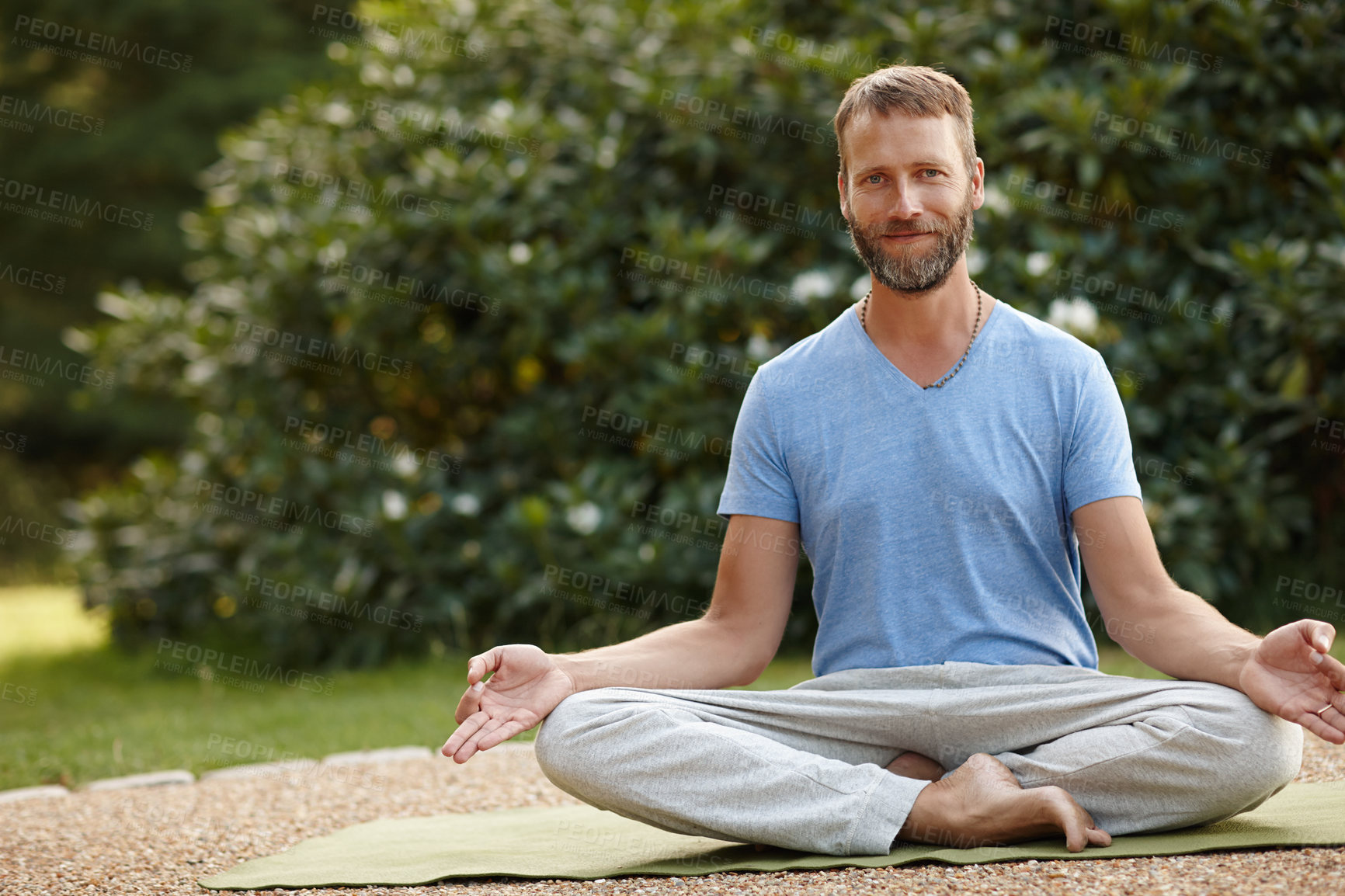 Buy stock photo Lotus meditation, portrait and man in nature with calm, relax and balance for mindfulness. Zen, outdoor and male person from Italy with padmasana pose for breathing, health and wellness outdoor.