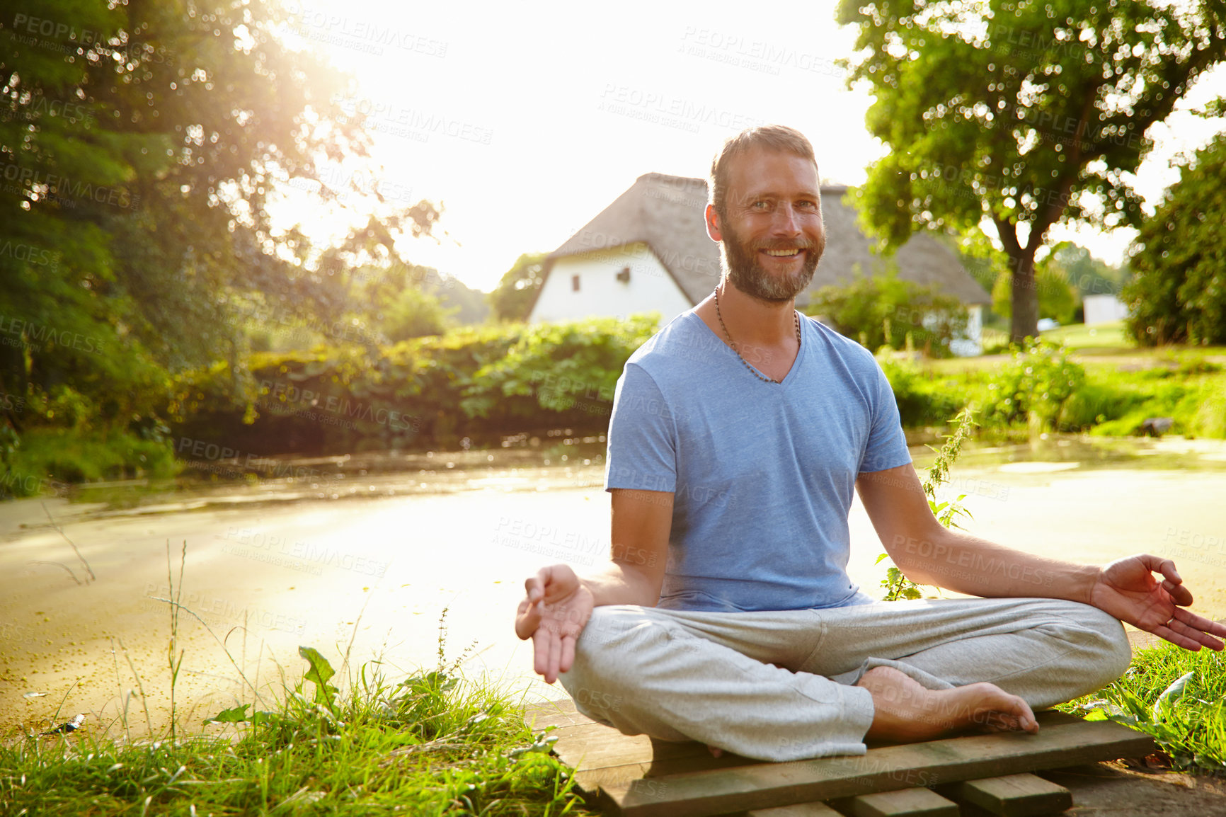 Buy stock photo Lotus meditation, portrait and man outdoor with calm, relax and balance for mindfulness. Zen, nature and male person from Italy with padmasana pose for breathing, health and wellness outdoor.