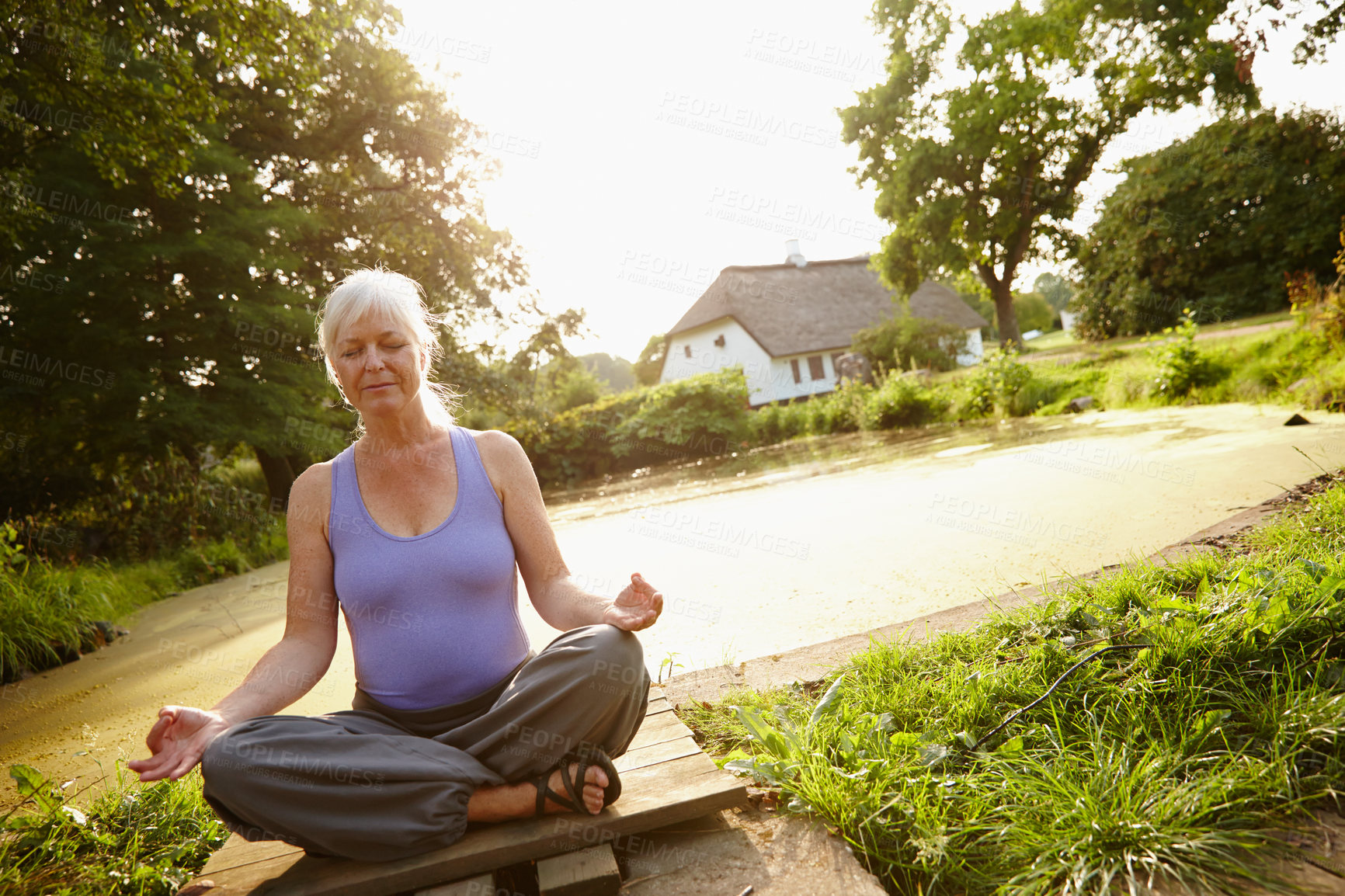 Buy stock photo Healthy, yoga and old woman in park, meditation and peace with wellness, nature and fitness. Workout, pensioner and mature person on grass field, exercise and morning routine with retirement or relax