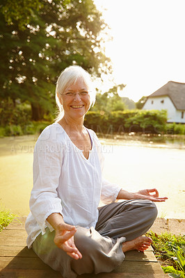 Buy stock photo Wellness, lotus meditation and woman in nature for relax, calm and zen breathing in morning. Health, portrait and senior female person in padmasana for outdoor flexibility, balance and mindfulness.