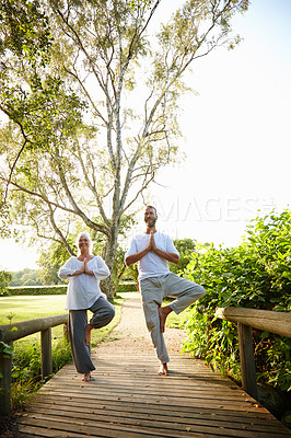 Buy stock photo Namaste, yoga and meditation for people, outdoor and fitness in nature, balance and mindfulness of aura. Chakra, lens flare and faith in park, wellness and spiritual for peace, soul and together