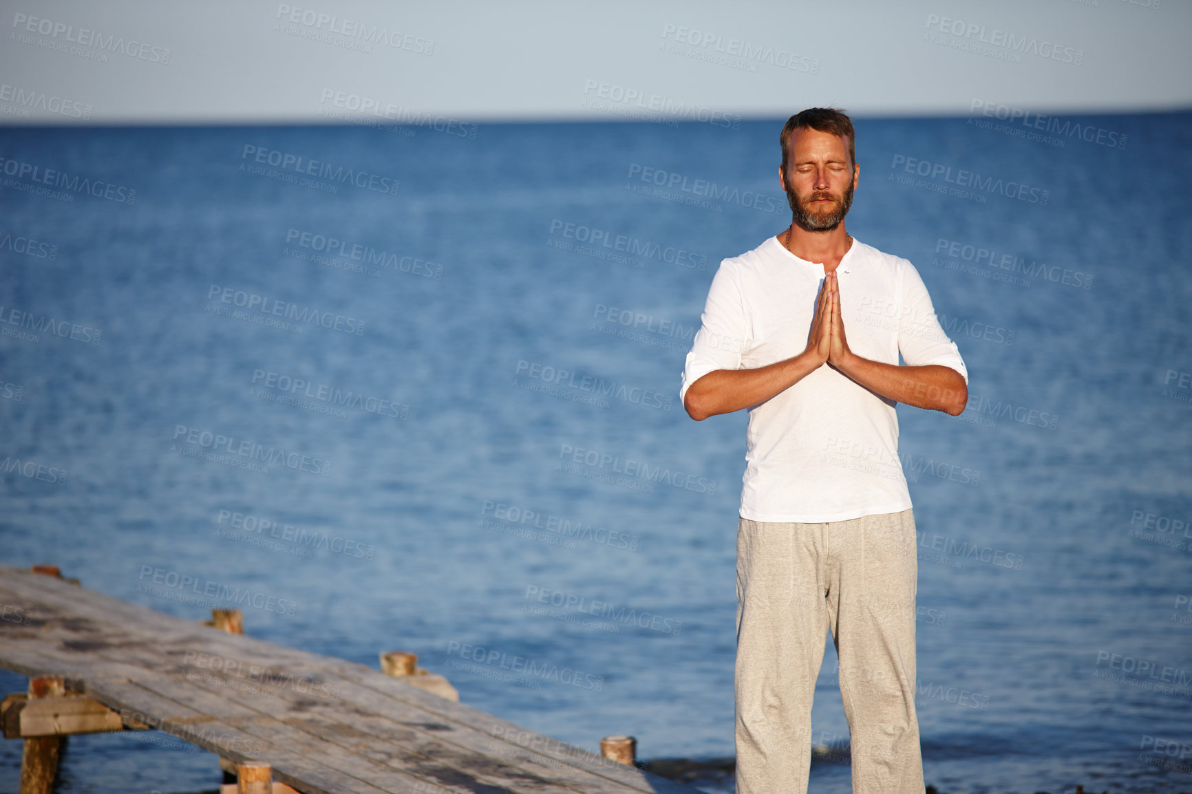 Buy stock photo Fitness, man and meditation with yoga at ocean of mindfulness healing, spiritual peace and performance. Mature person, zen and water with chakra zen for mental health, mindset balance and nature aura