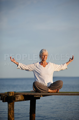 Buy stock photo Woman, relaxing and meditation for yoga by ocean with holistic care, spiritual wellness and mindfulness. Mature person, morning and pilates peace, mindset healing and performance with fitness outdoor