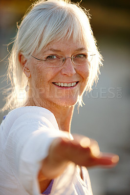 Buy stock photo Yoga, woman and warrior pose in nature for portrait, wellness and calm for mental health. Mature person, happy or face in outdoor pilates session with posture, spiritual healing or holistic activity