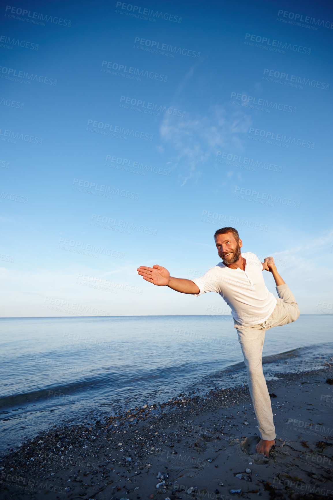 Buy stock photo Happy, man and stretching for yoga by ocean with flexible body, spiritual wellness and balance performance. Smile, mature person and warm up for chakra peace, mindfulness healing and fitness outdoor
