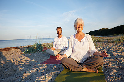 Buy stock photo Couple, relax and meditation for yoga by ocean with holistic care, spiritual wellness and mindfulness zen. Mature people, chakra and pilates peace, mindset healing and performance for fitness outdoor