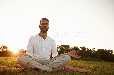 Buy stock photo Man, outdoor and sunset for lotus yoga position, meditation and mindfulness for healing chakra. Male person, sun flare and holistic pose for spiritual awareness, morning fitness and peace in exercise