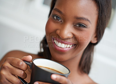 Buy stock photo A young ethnic woman enjoying a cup of coffee