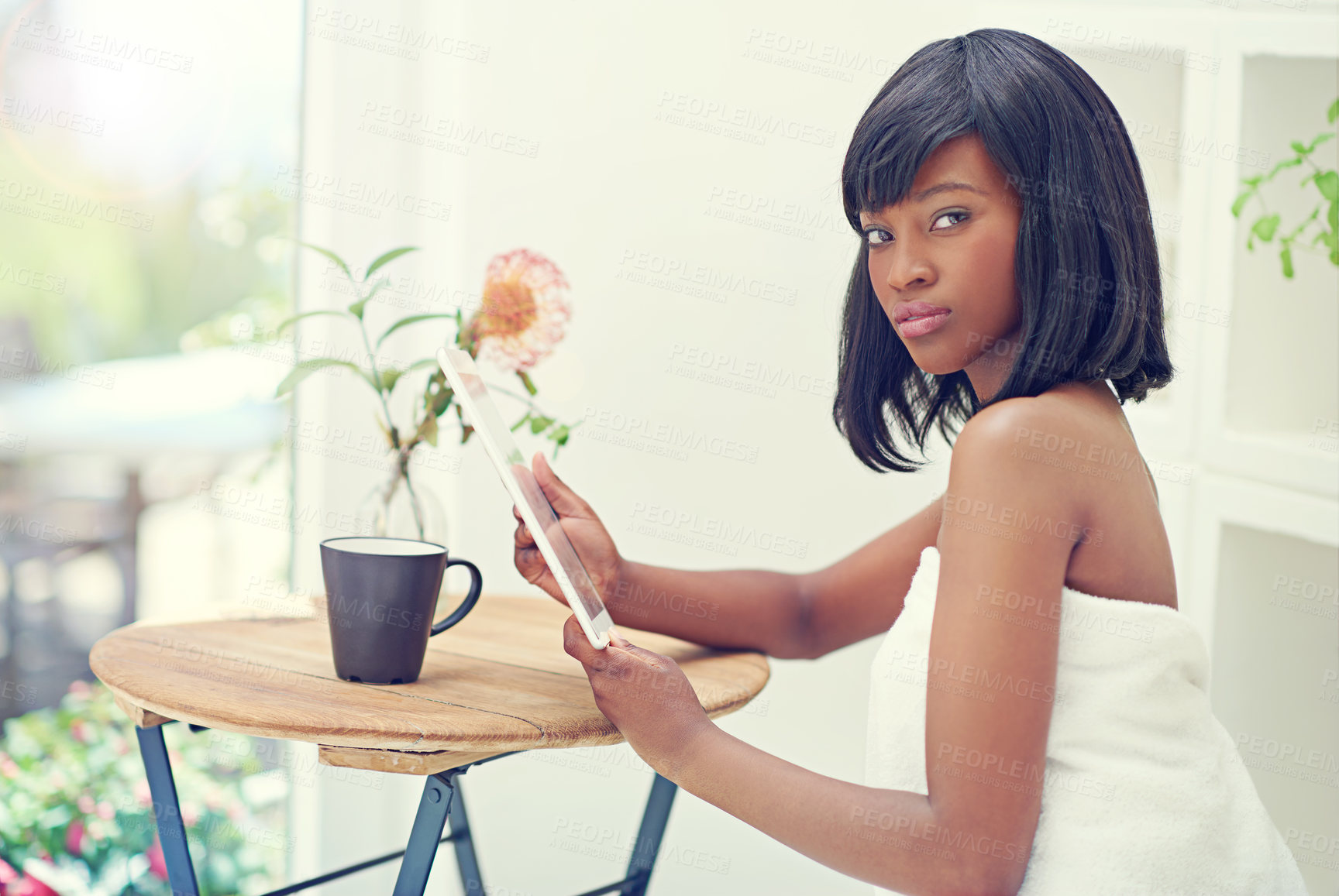 Buy stock photo Portrait, black woman and home with tablet on towel to browse internet for beauty or skincare tips or routine. Female person, house and relax in morning with social media, networking or communication