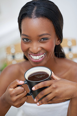 Buy stock photo A young ethnic woman enjoying a cup of coffee