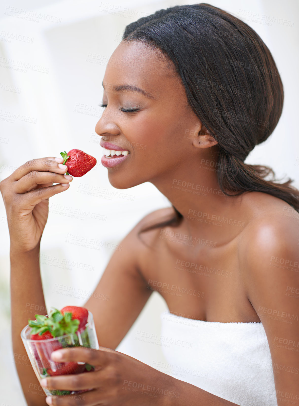 Buy stock photo Black woman, vitamins and strawberry in home for diet, nutrition and organic fruit for wellness. Female person, fresh and morning breakfast at kitchen table, vegan and paleo food for weight loss