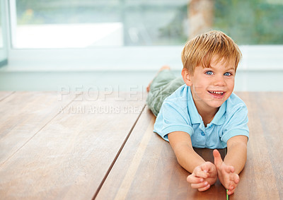 Buy stock photo Happy, portrait and young child on floor in family home, wellness and playing games in lounge. Boy, face and smile in living room for fun, care and excited english kid, growth and toddler development