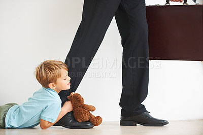 Buy stock photo Sad, child and businessman to leave for work, tantrum and closeup with anxiety, stress or mental health. Father, kid or begging on floor to stop dad, corporate worker and professional accountant

