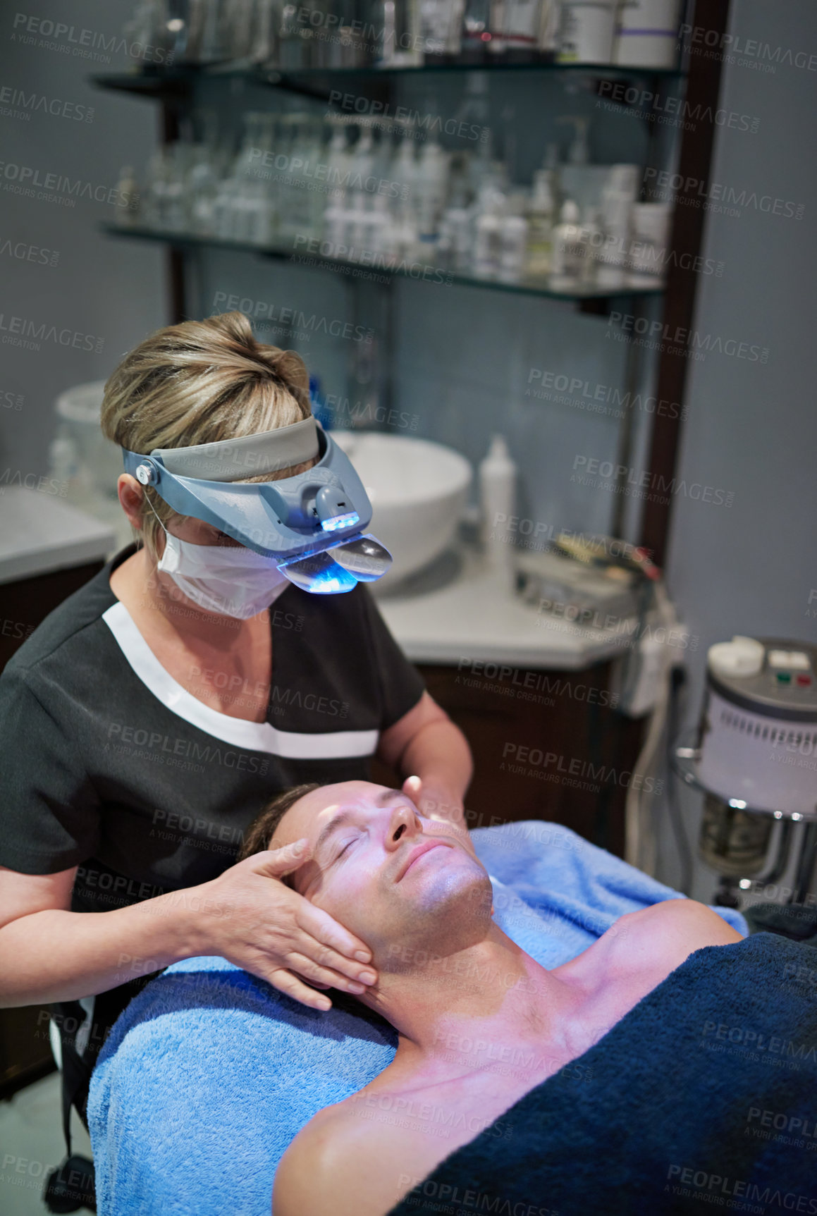 Buy stock photo Shot of a man getting a facial treatment at a beauty clinic