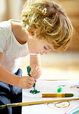 Buy stock photo Painting, creative and boy kid with homework, assignment or project for school at home. Colorful, artist and young student creating art on paper for hobby, child development or activity at house.
