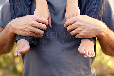 Buy stock photo Closeup shot of a father carrying his son on his shoulders