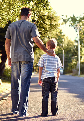 Buy stock photo Back view, father and child walking on street together for bonding, support and love on vacation or holiday in summer. Care, talking and dad on road with kid in neighborhood on weekend as parent