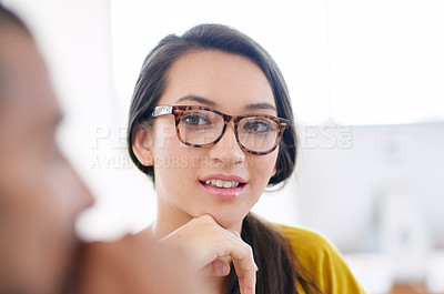 Buy stock photo Portrait of an attractive young woman sitting in a meeting with coworkers