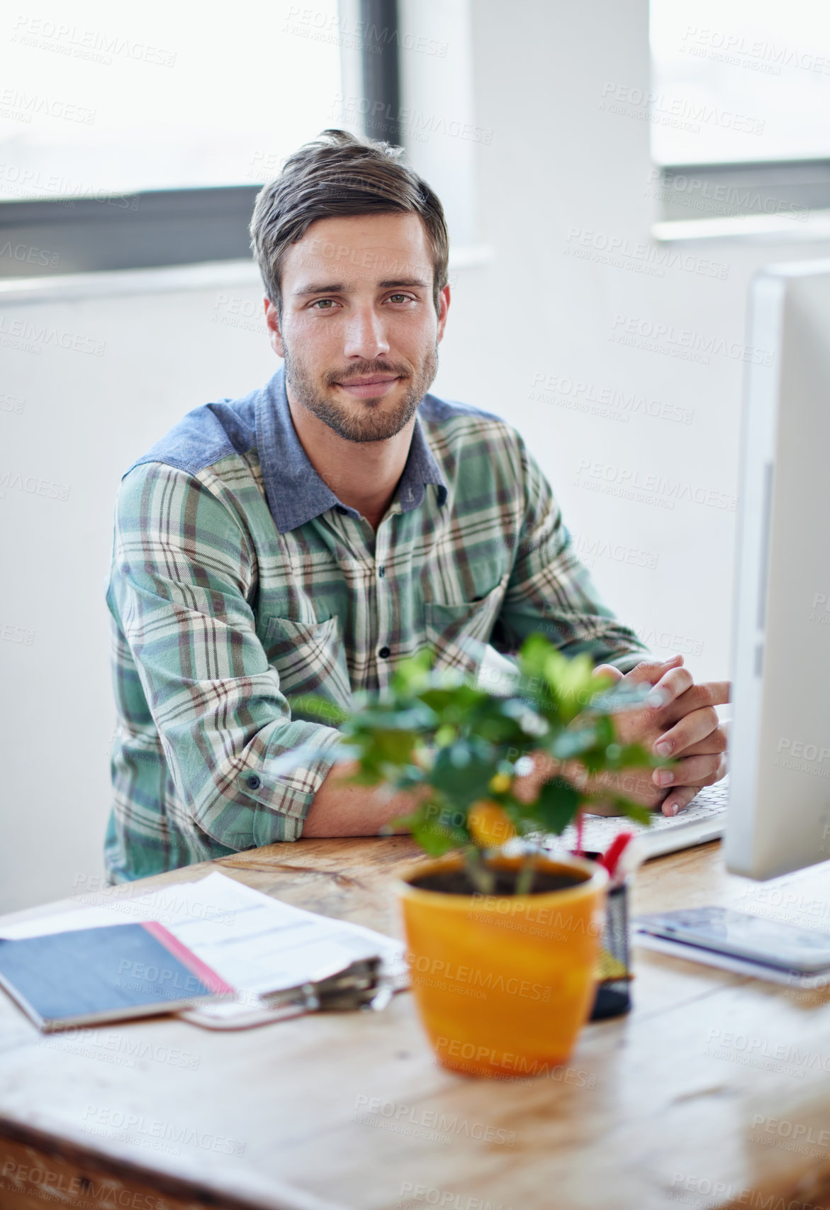 Buy stock photo Portrait of a young designer working on a computer in an office