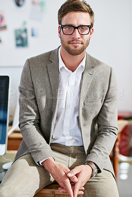 Buy stock photo Portrait, glasses and focus with a business man in the office for corporate or professional work. Face, eyewear and leadership with a young male manager sitting in a workplace on a blurred background